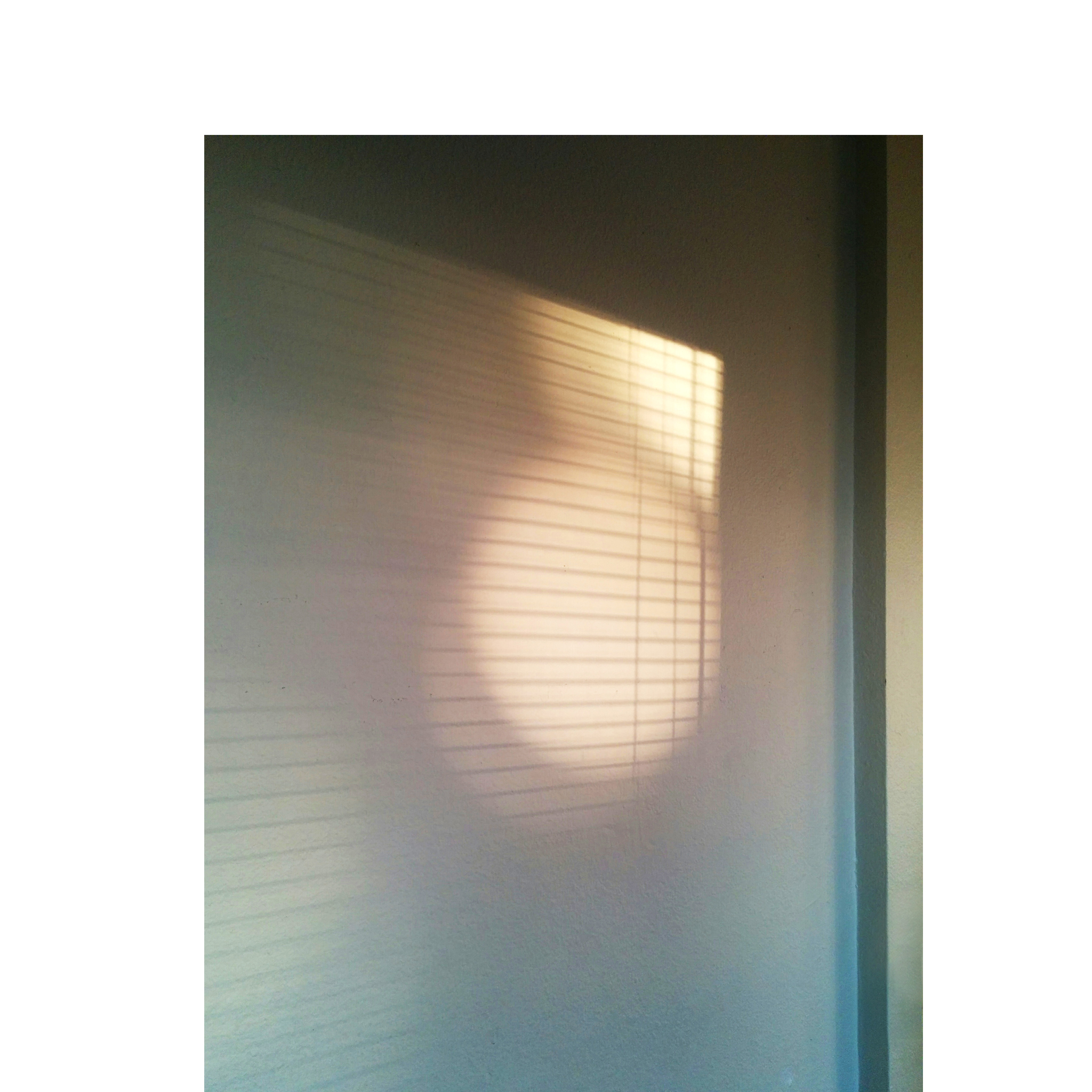 light spots and shadows cast from blinds