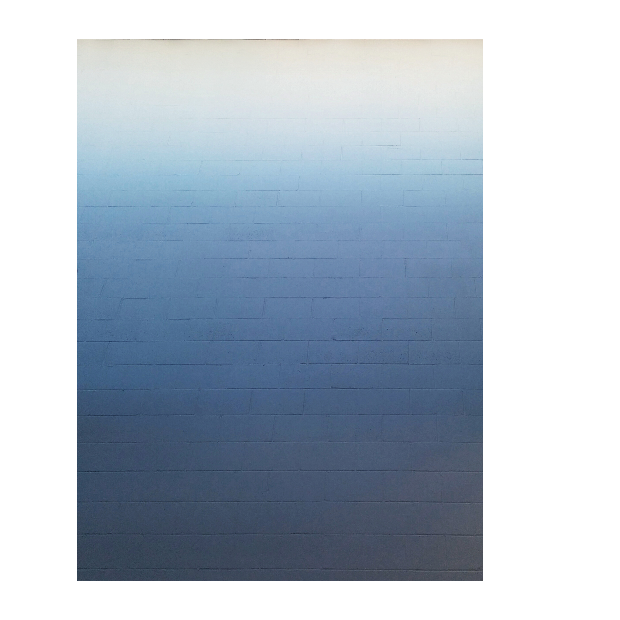 dark blue to white gradient on a brick wall